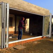 During: 5-panel white aluminium bifold door