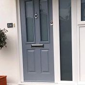 Light grey traditional style composite door with escutcheon multi-lock