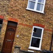 Vertical sliding sash windows to this Victorian terraced cottage.